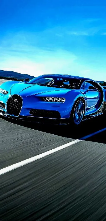 Blue Bugatti supercar on road with clear sky background.