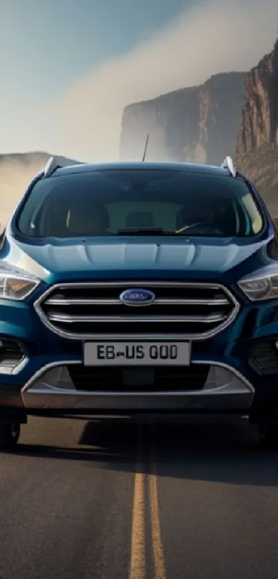 Blue SUV driving on a scenic road with mountain backdrop.