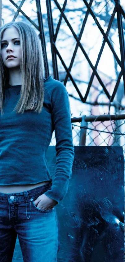 Stylish woman in blue jeans against urban backdrop.