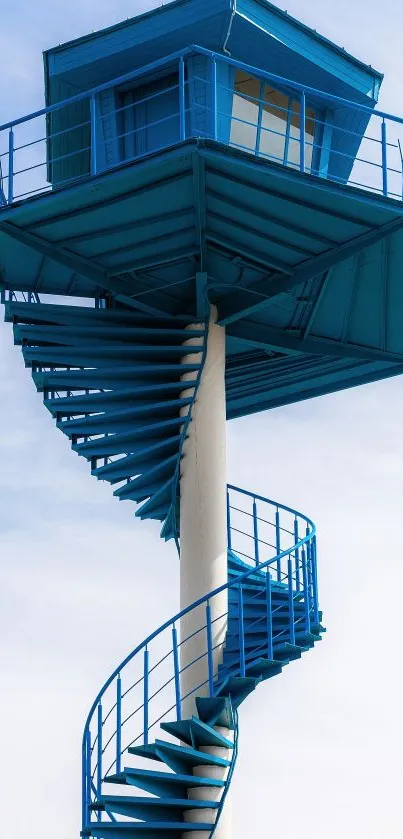 Modern blue tower with spiral stairs against a clear sky, ideal for mobile wallpaper.