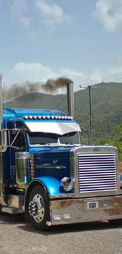 Wallpaper of a blue truck on a scenic mountain road.