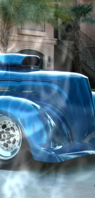 A sleek blue vintage car parked outside a modern home.