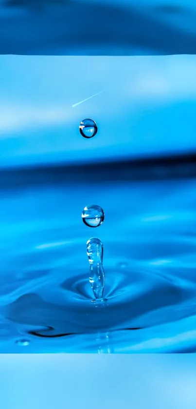 Vibrant blue water droplet on calm surface.