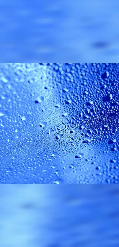 Blue wallpaper with water droplets creating a soothing texture.