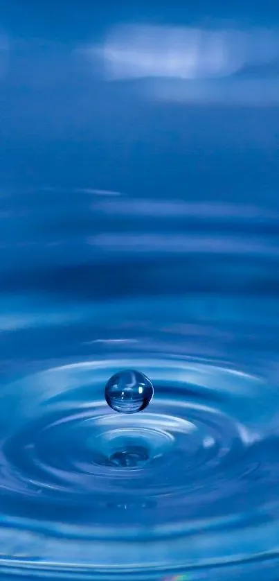 Blue water ripple with suspended droplet on mobile wallpaper.