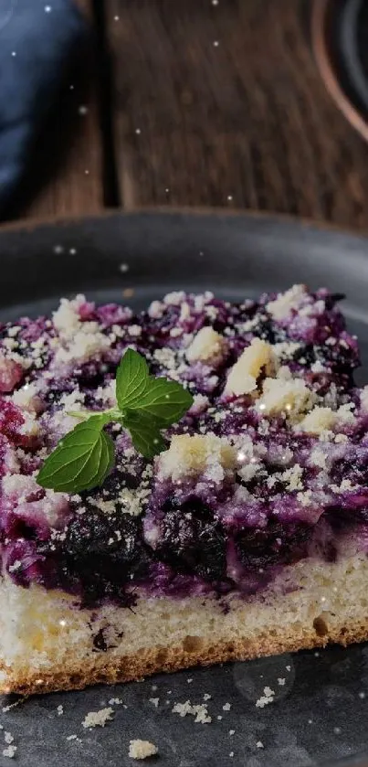 Blueberry dessert with mint leaf on a dark plate wallpaper.