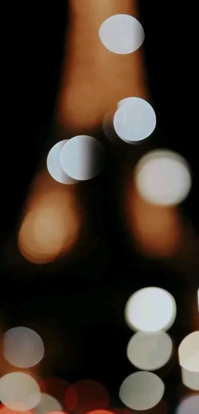 Blurred bokeh lights resembling the Eiffel Tower at night.