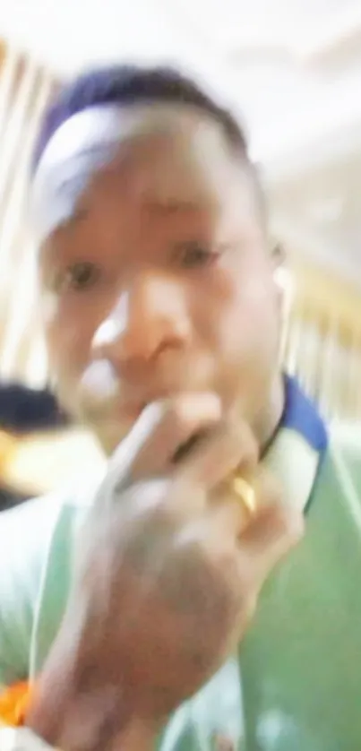 Blurred abstract portrait in soft tones, featuring a room background.