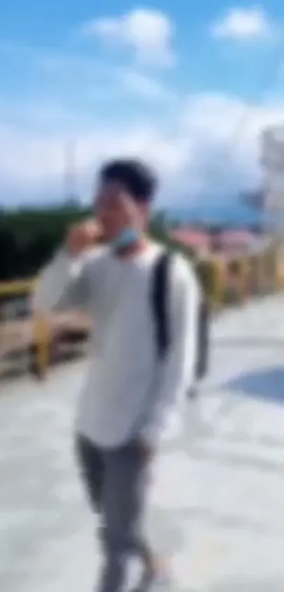 Blurred image of person walking on urban street.