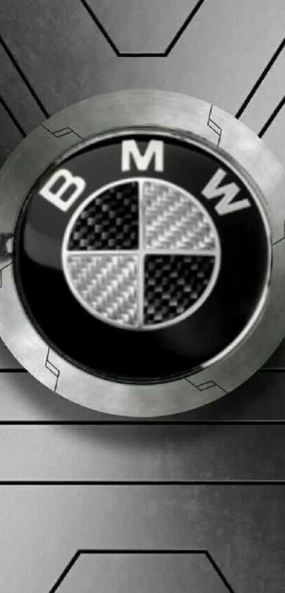 BMW logo on a metallic gray background with geometric patterns.