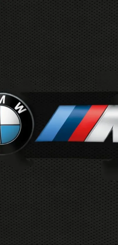 BMW M logo on a black textured background wallpaper.