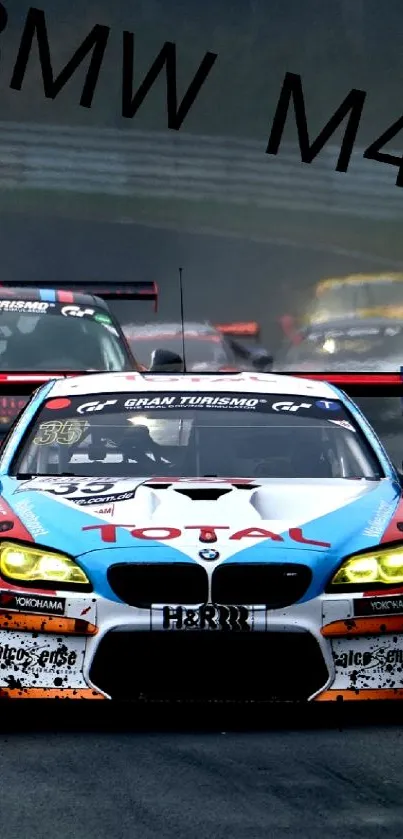 BMW M4 racecar leads on a rainy track, showcasing speed and performance.