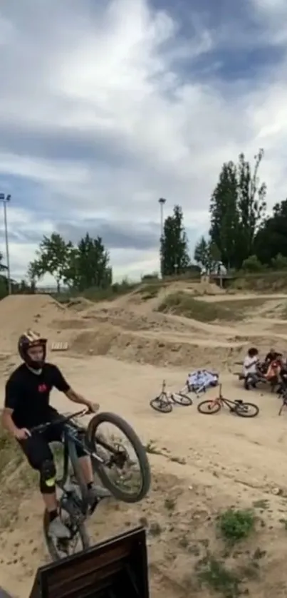 Cyclist performing a BMX stunt in a park.