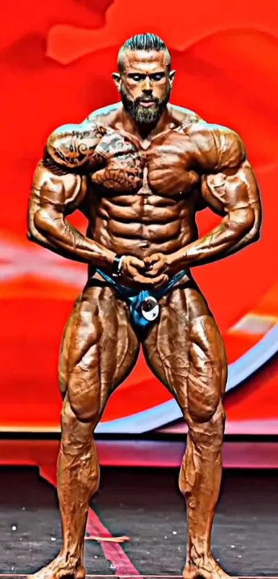 Bodybuilder posing on a vibrant red stage.