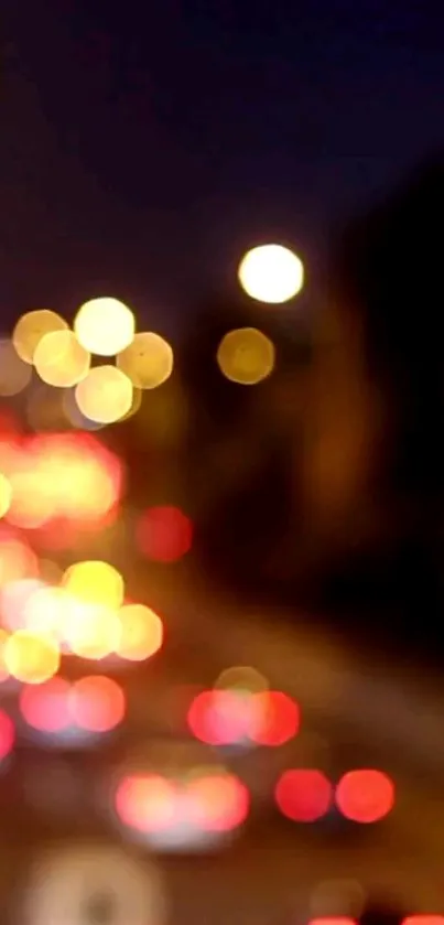 Bokeh city lights wallpaper with vibrant red and yellow hues.