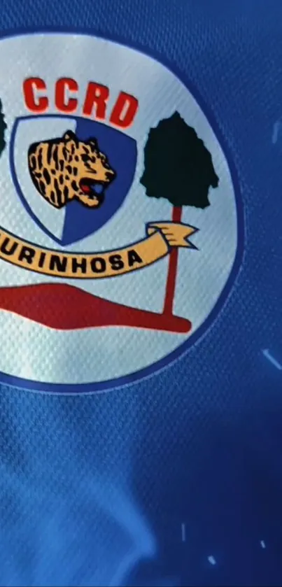 Blue themed emblem design with symbolic elements on fabric.