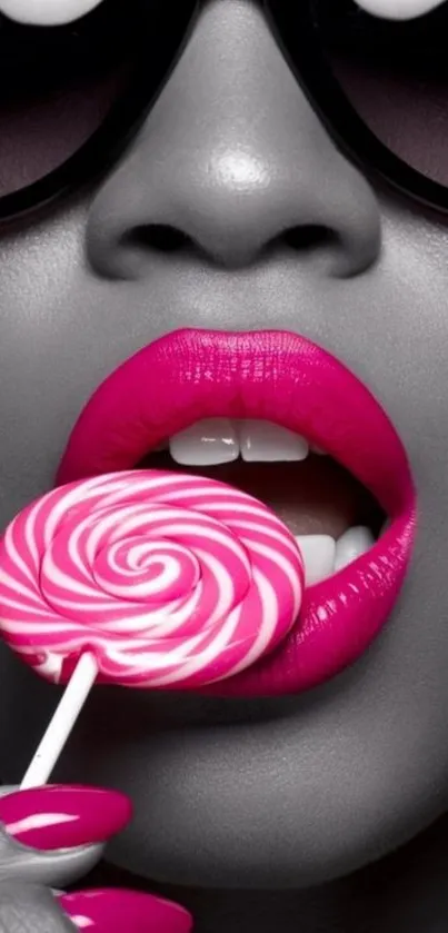 Close-up of vibrant pink lips with a lollipop.