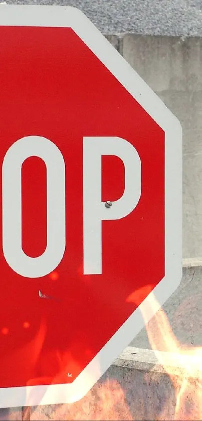 Bold red stop sign with concrete backdrop for phone wallpaper.