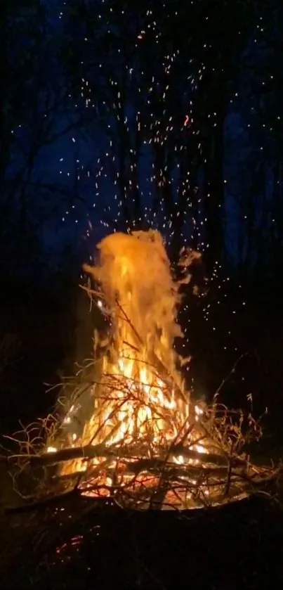 A vibrant bonfire illuminates a dark forest night, sparks flying upward.