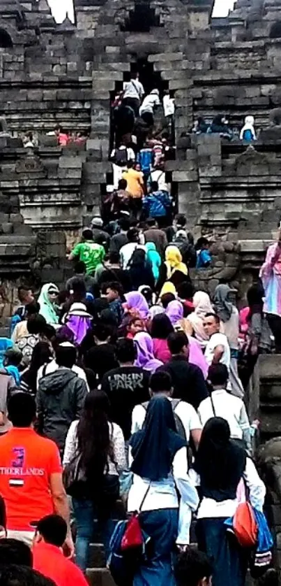 Visitors climbing Borobudur Temple, Indonesia.