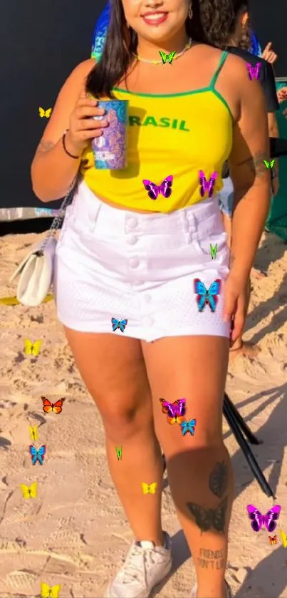 Woman in a bright, vibrant outfit standing on a sunny beach.