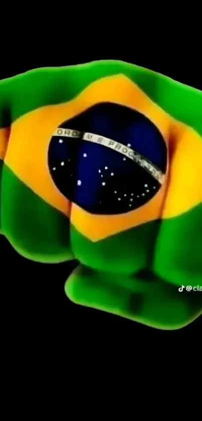 Green fist with Brazilian flag design on black background.