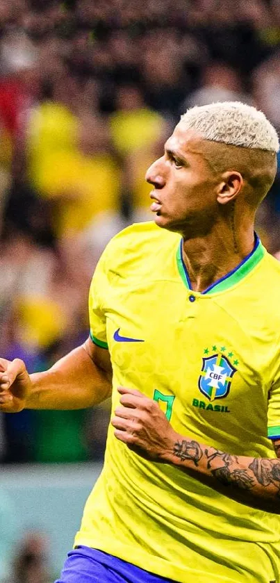 Brazilian soccer player in yellow jersey celebrating during a match.