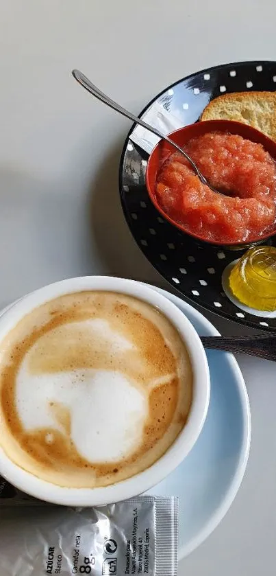 Cup of coffee with toast and tomatoes on a polka dot plate.