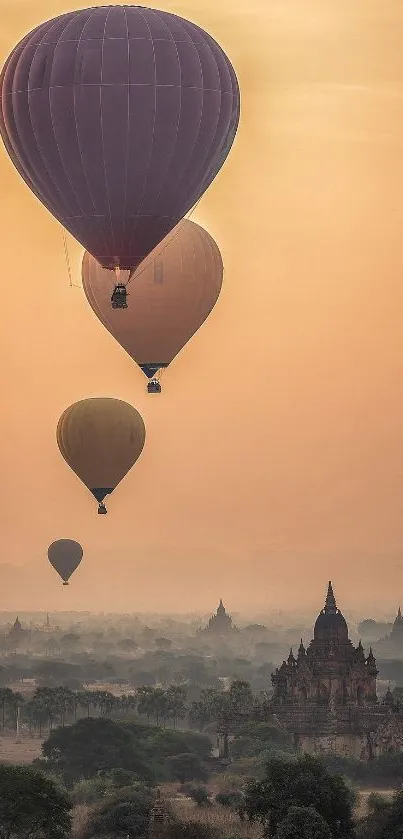 Hot air balloons over ancient temples at sunrise.