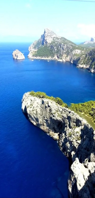 Stunning cliff with vibrant blue ocean and lush greenery.