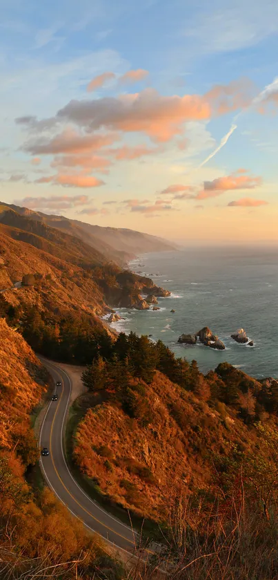 Sunset coastal road view with ocean and mountains.