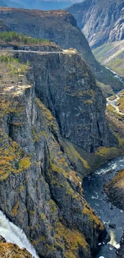 A stunning mobile wallpaper featuring a mountain gorge with flowing river.