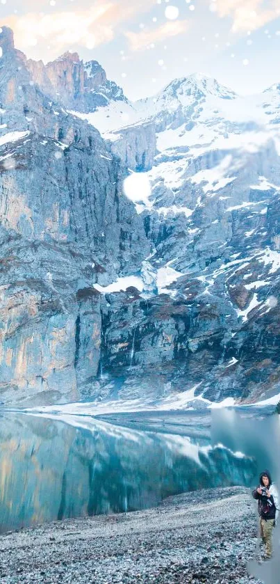 Serene snowy mountain landscape with tranquil lake reflections.