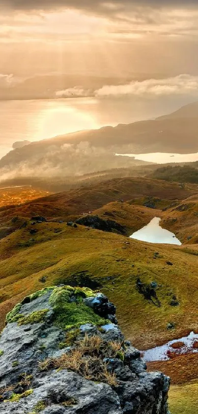 Sunrise over a scenic mountain landscape.