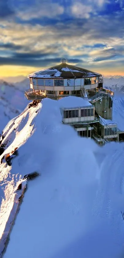 Stunning snowy mountain peak at sunset with vibrant sky hues.