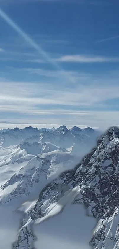 Snowy mountain peaks beneath a clear blue sky.