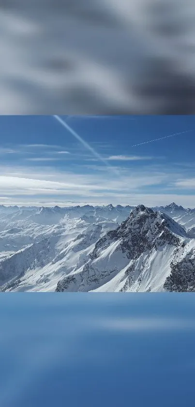 A breathtaking view of snowy mountains under a vast blue sky.