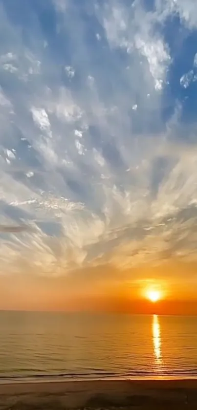 Sunset over a calm beach with vivid colored sky.