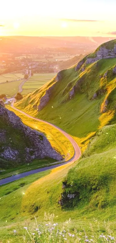 A stunning sunset illuminates a green valley landscape.