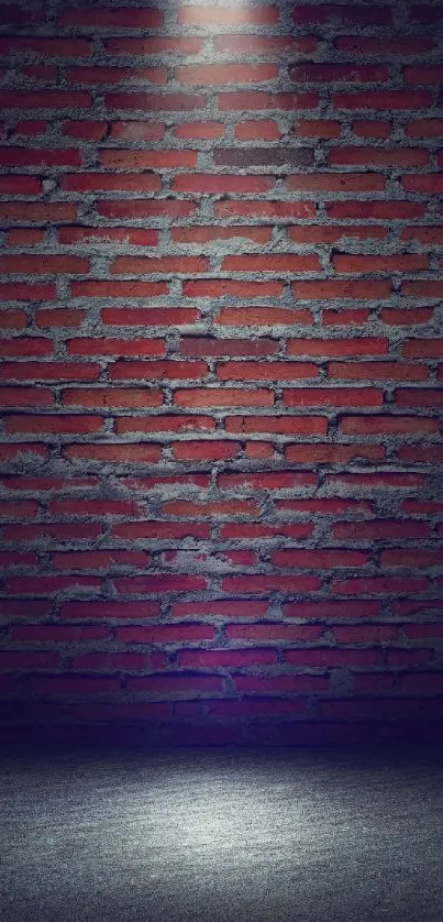 Red brick wall under a spotlight, creating a dramatic effect.