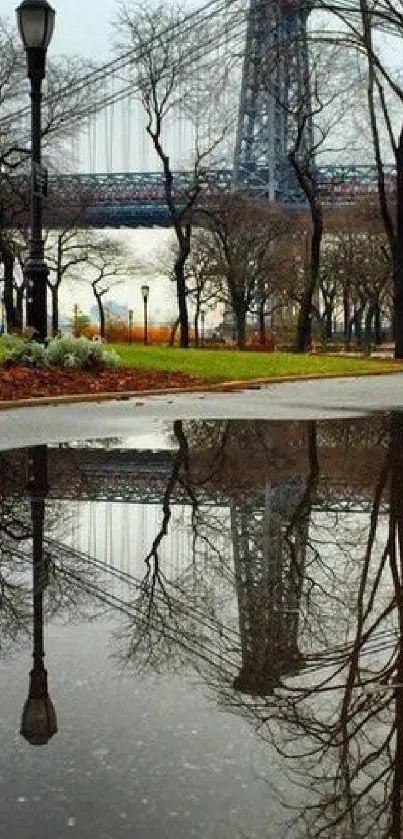 Reflective autumn scene with bridge and trees on a serene urban landscape.