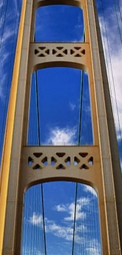 Golden bridge against a blue sky with white clouds.