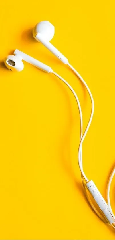 White earphones on bright yellow background.