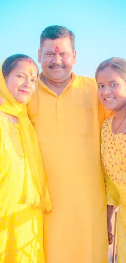 Family in bright yellow under blue sky.