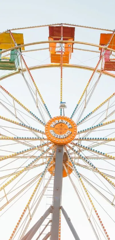 Colorful Ferris wheel against clear sky.