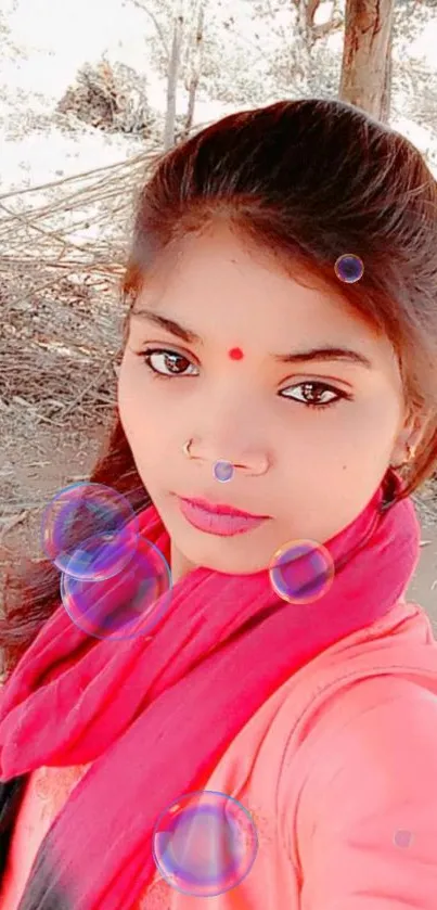 Outdoor portrait of a young woman in vibrant red and orange attire.