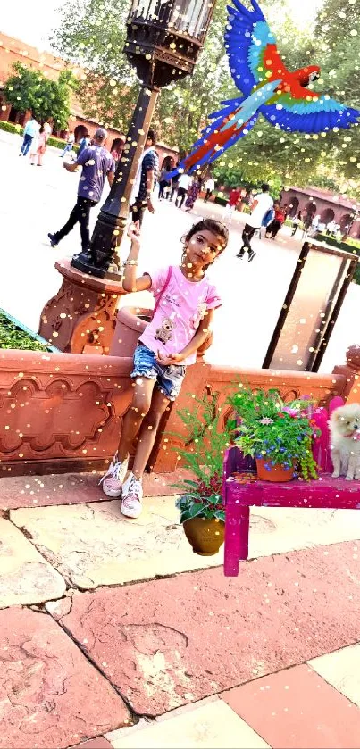 Child in a park with parrot and dog on a vibrant pink bench.