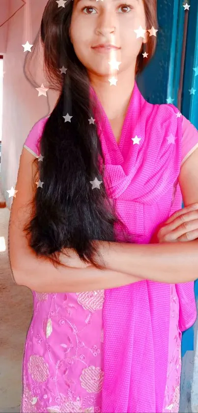 Young person in vibrant pink dress with stars on mobile wallpaper.