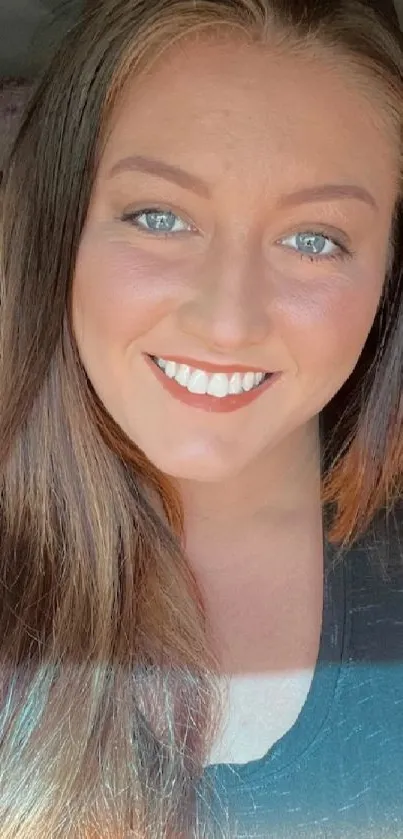 Smiling woman with bright hair in car.