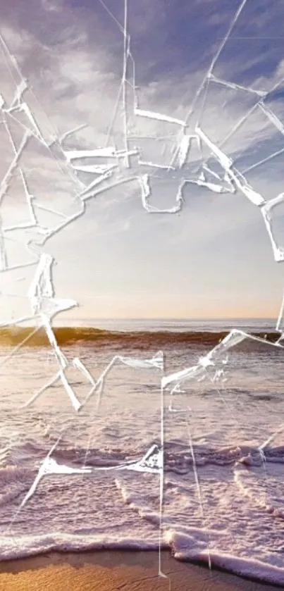 Surreal beach scene with cracked glass effect over ocean waves at sunset.